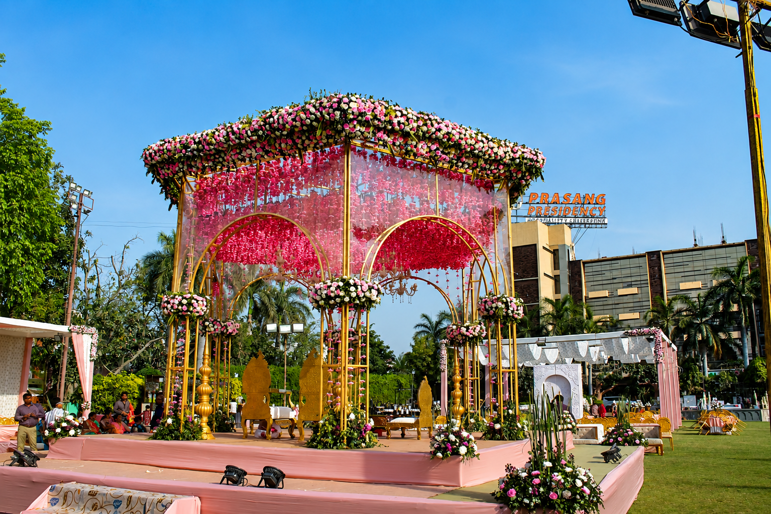 Grand LED paisley light gate entrance with garlands and drapes for a live event
