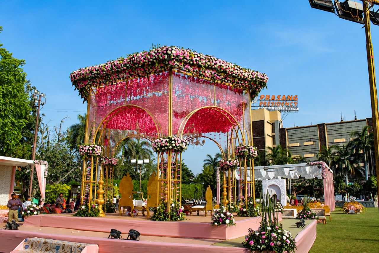 Grand LED paisley light gate entrance with garlands and drapes for a live event
